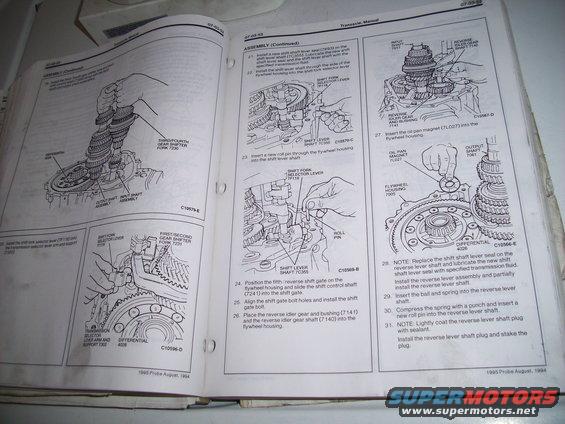 Pages from a transmission repair manual showing diagrams and assembly steps