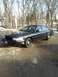 2006 Ford Crown Victoria - A black sedan is parked outside on a paved surface with bare trees and some snow visible.