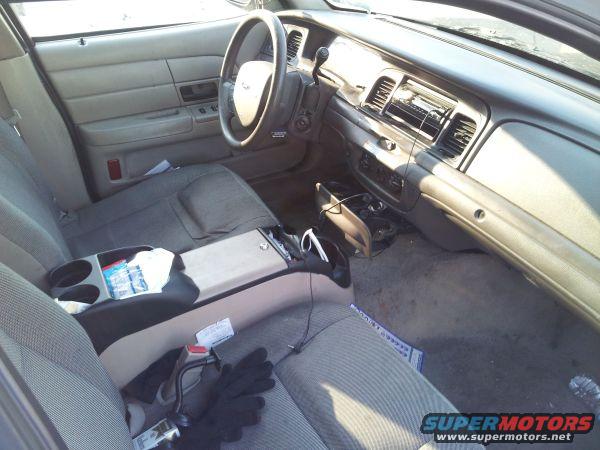 Interior view of a 2006 Ford Crown Victoria showing dashboard, steering wheel, and seats