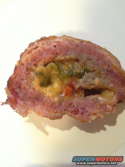 slice of meatloaf stuffed with cheese and chopped peppers