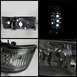 1992 Ford Bronco - Close-up of a vehicle headlight assembly, displaying its internal components and design.