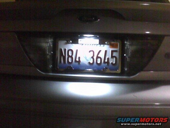 2003 Ford Crown Victoria rear with license plate N84 3645 illuminated by bright lights