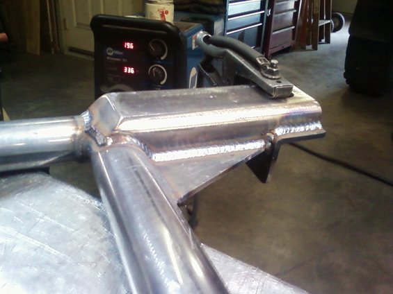 Welding machine with digital display and metal tubing assembly with visible welds