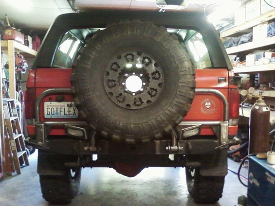 1989 Ford Bronco rear view with custom tire carrier and Washington license plate reading GOTFLEX