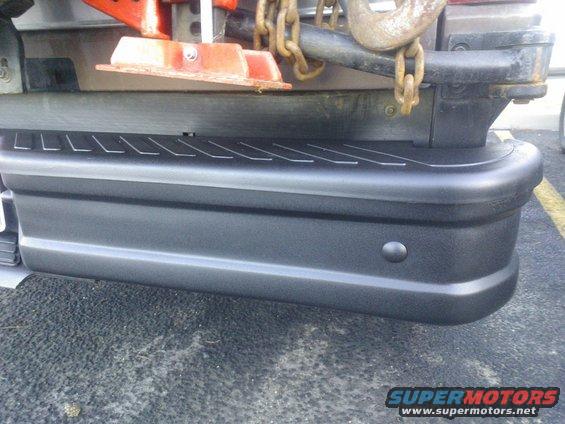 Rear bumper with step and tow hitch chains