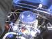 2003 Ford Crown Victoria - Close-up view of a car's engine bay with various components visible.