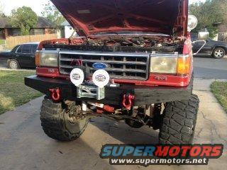 1990 Ford Bronco front view, hood up, with aftermarket bumper and winch