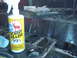 1978 Ford Bronco - A bottle of Scent Killer is placed on a surface with tools, suggesting preparation or cleaning.