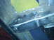1978 Ford Bronco - This photo shows a close-up view of metal frame repair work, possibly on a vehicle's undercarriage.