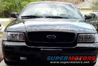 Front view of a black 2008 Ford Crown Victoria with a black grille and Ford logo
