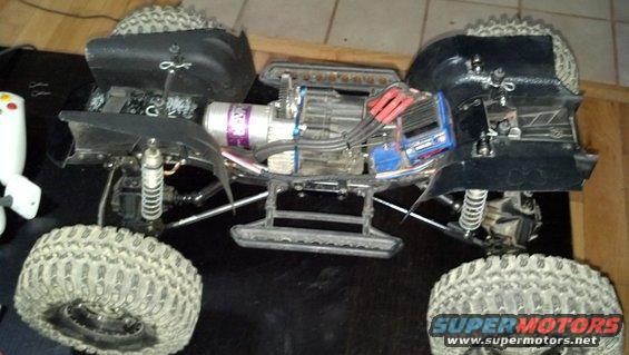 Remote control monster truck with exposed electronics and large tires