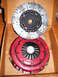2004 Ford Crown Victoria - A clutch disc and pressure plate are shown inside a cardboard box.