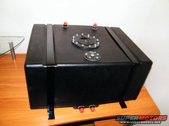 Black fuel cell with two red capped fittings on top and two on the bottom