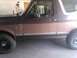 1992 Ford Bronco - This 1992 Ford Bronco is shown from the side, with its two-tone brown paint scheme and chrome trim.