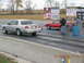 2003 Ford Crown Victoria - Two cars line up on a drag strip, with a silver 2003 Ford Crown Victoria on the left.