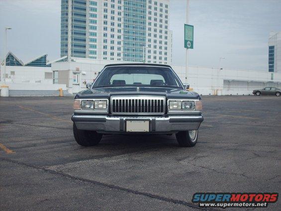 Front view of a 1991 Mercury Grand Marquis with a chrome grille