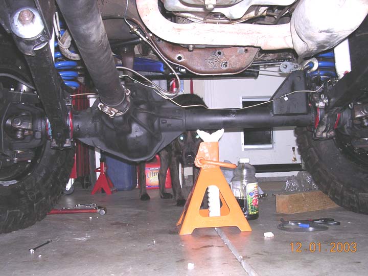 back-of-front.jpg the 60 is in, just waiting to finish the longer center link and track bar.  Used the stock '79 D44 lines, and just hand bent them a little.  Securing the brakelines took a little work, but everything is up high and out of rocks way.  Also gives you an idea of how much further over the pumpkin is.