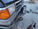 1990 Ford Bronco - Custom brush guard installed on a gray Ford truck, a chrome grille and tow hooks.