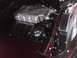 2003 Ford Crown Victoria - Close-up view of a V8 engine, likely a performance upgrade, in a vehicle's engine bay.