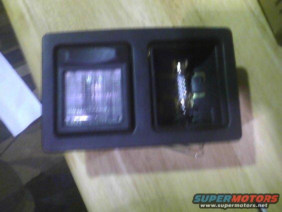 Car interior light assembly with two housings, one with a lens