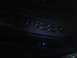 2003 Ford Crown Victoria - Illuminated window controls are visible on the dark interior door panel of a car.
