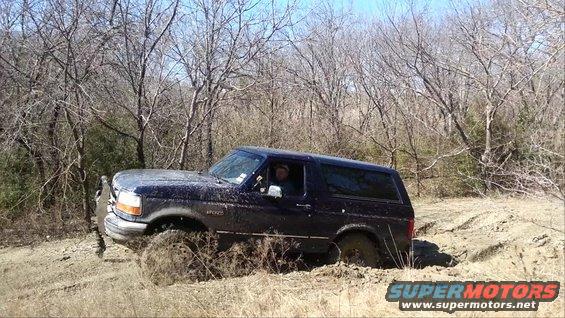 1995 Ford Bronco stuck in mud off-road