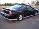 2002 Chevrolet Monte Carlo - This black Chevrolet Monte Carlo SS is shown from a rear three-quarter view, highlighting its sporty design and spoiler.