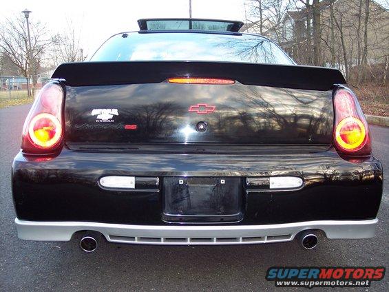 Black 2002 Chevrolet Monte Carlo SS rear with spoiler and dual exhaust