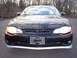 2002 Chevrolet Monte Carlo - The front of a black Chevrolet Monte Carlo is shown with the headlights illuminated.