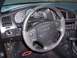 2002 Chevrolet Monte Carlo - The dashboard of a Chevrolet Monte Carlo features a steering wheel with controls and a full set of gauges.