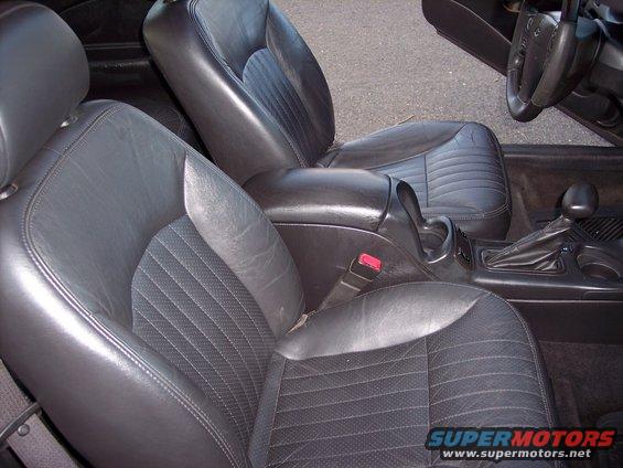 Interior of a 2002 Chevrolet Monte Carlo showing black leather bucket seats and center console