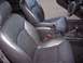 2002 Chevrolet Monte Carlo - The interior of a 2002 Chevrolet Monte Carlo features black leather bucket seats and a center console with a gear shifter.