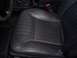 2002 Chevrolet Monte Carlo - Interior view of a worn black leather car seat, including the steering wheel and gear shifter.
