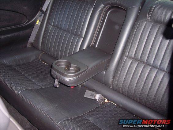Black leather rear seats with center console cup holder in a 2002 Chevrolet Monte Carlo
