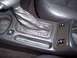 2002 Chevrolet Monte Carlo - Interior view of a car's center console, highlighting the gear shifter and heated seat controls.
