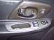 2002 Chevrolet Monte Carlo - Close-up of a car's interior door panel, showing the window controls and door handle.
