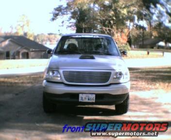 Front view of a silver 2000 Ford F-150 pickup truck with a hood scoop