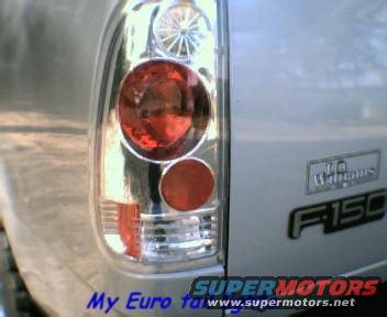 Close-up of 2000 Ford F-150 taillight assembly and F-150 badge