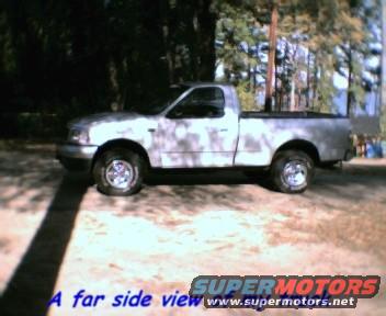 Silver 2000 Ford F-150 pickup truck, side view