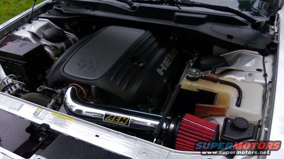 Engine bay of a Dodge Challenger with a HEMI V8 engine and AEM cold air intake