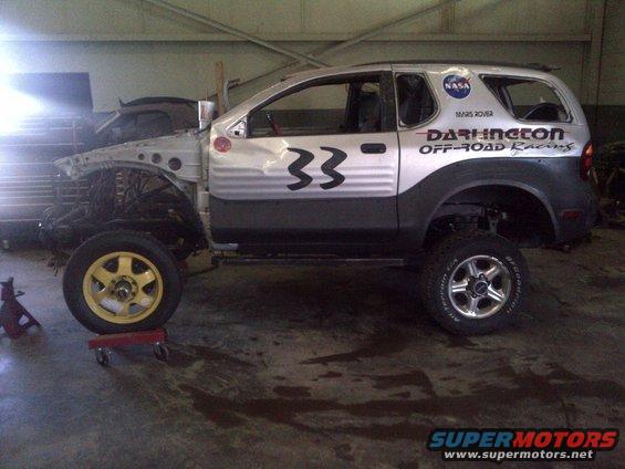 SUV with front end removed, number 33 on door, NASA and Darlington Off-Road Racing decals
