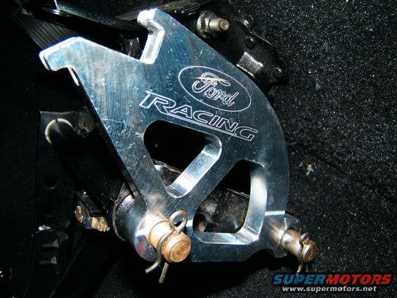 Ford Racing brake caliper bracket with visible Ford logo and "RACING" text