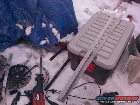 Electric fan and SKIL reciprocating saw on snowy ground