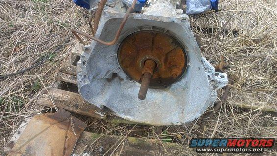 rusted automatic transmission part with torque converter visible