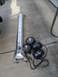 1994 Jeep Cherokee - Off-road lighting components, including a light bar and two KC lights, are laid out on a concrete surface.