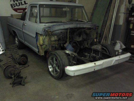 1967 Ford F-100 truck, primer gray, front end removed, in garage