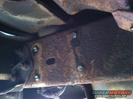Rusted frame section with bolts