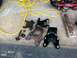 1996 Ford Bronco - Various vehicle suspension components, including old and new parts, are arranged on a concrete surface alongside tools and tools.