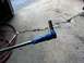1996 Ford Bronco - A bolt with blue tape wrapped around its shaft is shown, likely for a spring hanger replacement.