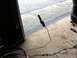 1996 Ford Bronco - A metal tube, possibly a brake line or fuel line, is shown with blue tape on its threaded end.